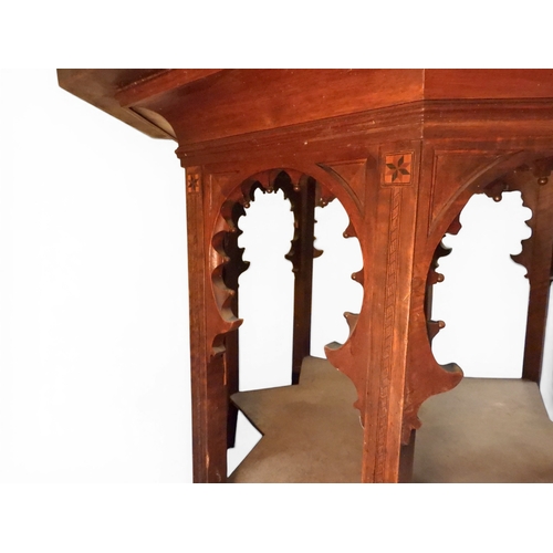 2053 - A LARGE ARABESQUE STYLE OCTAGONAL CENTRE TABLEwith central circular brass tray embossed with reclini... 
