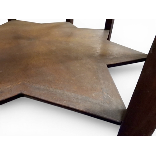 2053 - A LARGE ARABESQUE STYLE OCTAGONAL CENTRE TABLEwith central circular brass tray embossed with reclini... 