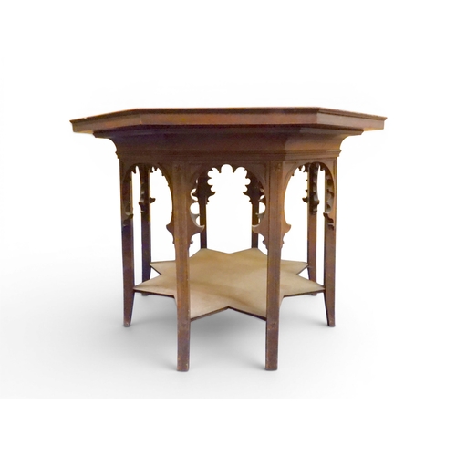 2053 - A LARGE ARABESQUE STYLE OCTAGONAL CENTRE TABLEwith central circular brass tray embossed with reclini... 