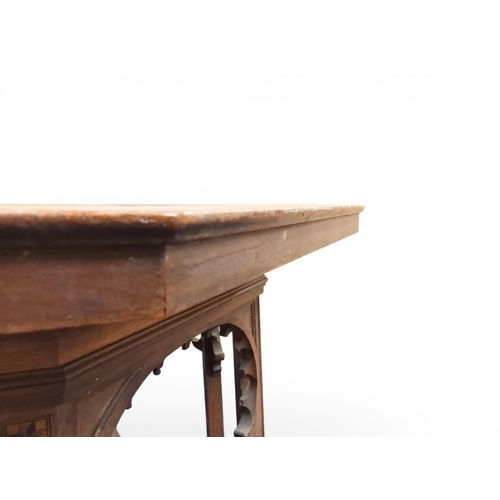 2053 - A LARGE ARABESQUE STYLE OCTAGONAL CENTRE TABLEwith central circular brass tray embossed with reclini... 