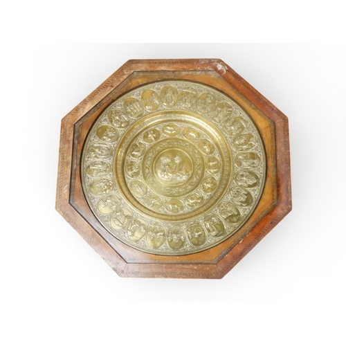 2053 - A LARGE ARABESQUE STYLE OCTAGONAL CENTRE TABLEwith central circular brass tray embossed with reclini... 
