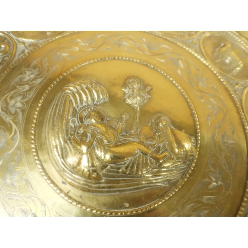 2053 - A LARGE ARABESQUE STYLE OCTAGONAL CENTRE TABLEwith central circular brass tray embossed with reclini... 