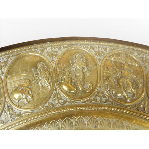 2053 - A LARGE ARABESQUE STYLE OCTAGONAL CENTRE TABLEwith central circular brass tray embossed with reclini... 