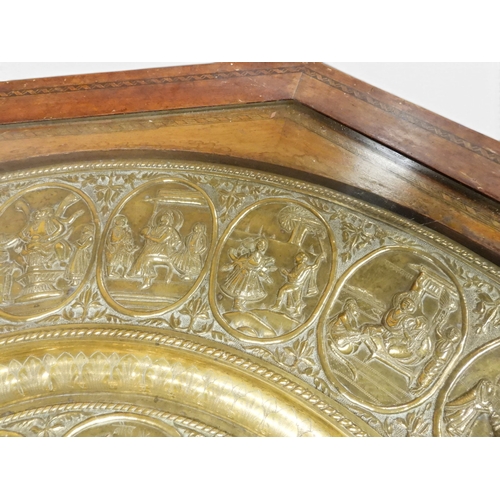2053 - A LARGE ARABESQUE STYLE OCTAGONAL CENTRE TABLEwith central circular brass tray embossed with reclini... 