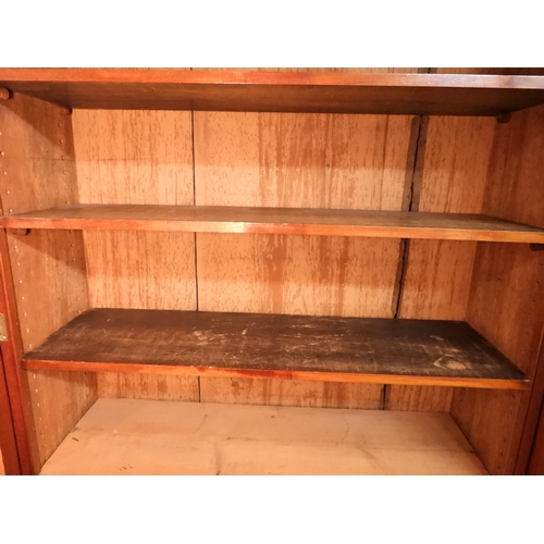 2055 - A LARGE VICTORIAN MAHOGANY BREAKFRONT LIBRARY BOOKCASEwith moulded cornice over four glazed doors on... 