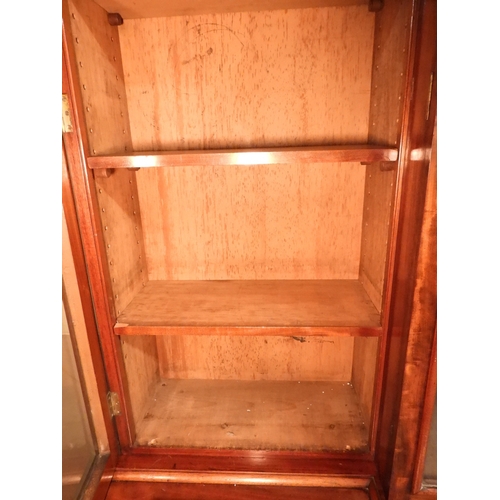 2055 - A LARGE VICTORIAN MAHOGANY BREAKFRONT LIBRARY BOOKCASEwith moulded cornice over four glazed doors on... 