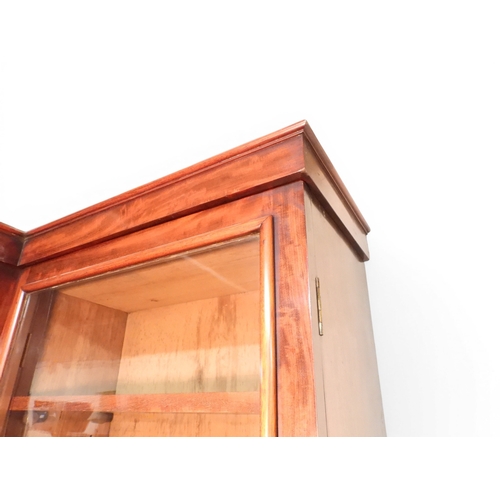 2055 - A LARGE VICTORIAN MAHOGANY BREAKFRONT LIBRARY BOOKCASEwith moulded cornice over four glazed doors on... 