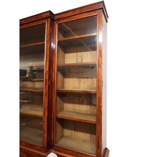2055 - A LARGE VICTORIAN MAHOGANY BREAKFRONT LIBRARY BOOKCASEwith moulded cornice over four glazed doors on... 