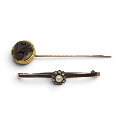 2753 - A CURIOUS TAXIDERMIED DOGS NOSE LAPEL PINmounted in bright yellow metal, diameter approx 17.8mm, wei... 