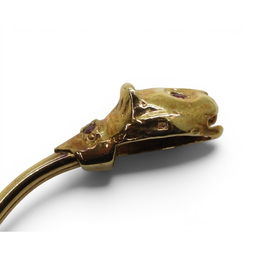 2756 - A LEOPARD BANGLEmade in 9ct gold and set with ruby eyes and collars. Inner diameter 6.2cm, weight 11... 