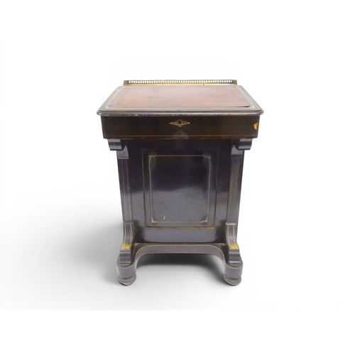 2002 - A VICTORIAN EBONISED AESTHETIC MOVEMENT DAVENPORT WRITING DESK with pierced brass gallery top over h... 
