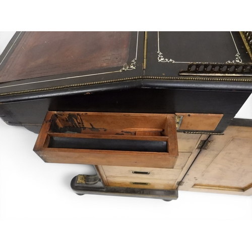 2002 - A VICTORIAN EBONISED AESTHETIC MOVEMENT DAVENPORT WRITING DESK with pierced brass gallery top over h... 