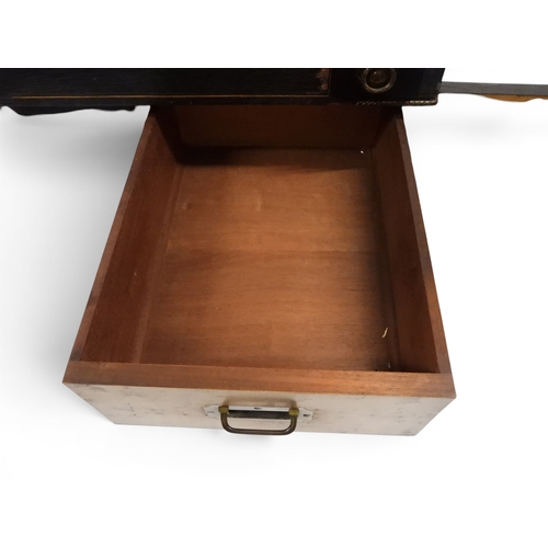 2002 - A VICTORIAN EBONISED AESTHETIC MOVEMENT DAVENPORT WRITING DESK with pierced brass gallery top over h... 