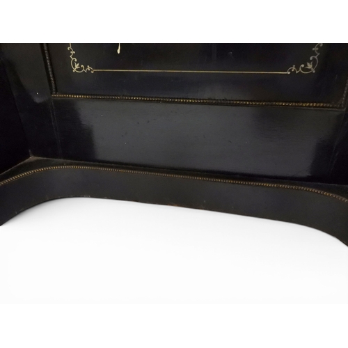 2002 - A VICTORIAN EBONISED AESTHETIC MOVEMENT DAVENPORT WRITING DESK with pierced brass gallery top over h... 