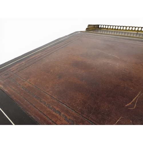 2002 - A VICTORIAN EBONISED AESTHETIC MOVEMENT DAVENPORT WRITING DESK with pierced brass gallery top over h... 
