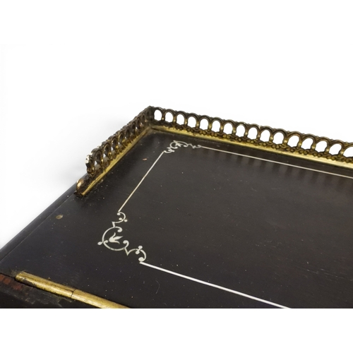2002 - A VICTORIAN EBONISED AESTHETIC MOVEMENT DAVENPORT WRITING DESK with pierced brass gallery top over h... 