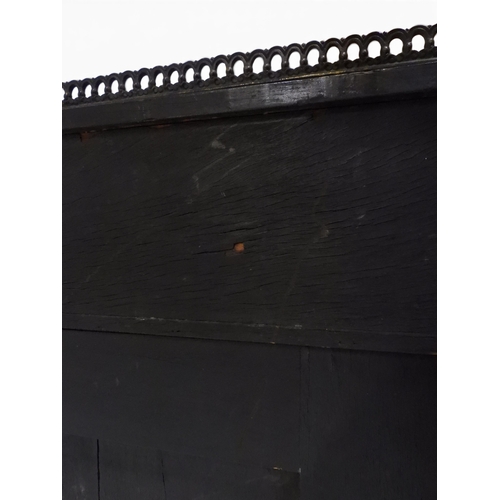 2002 - A VICTORIAN EBONISED AESTHETIC MOVEMENT DAVENPORT WRITING DESK with pierced brass gallery top over h... 