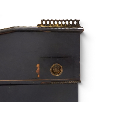 2002 - A VICTORIAN EBONISED AESTHETIC MOVEMENT DAVENPORT WRITING DESK with pierced brass gallery top over h... 