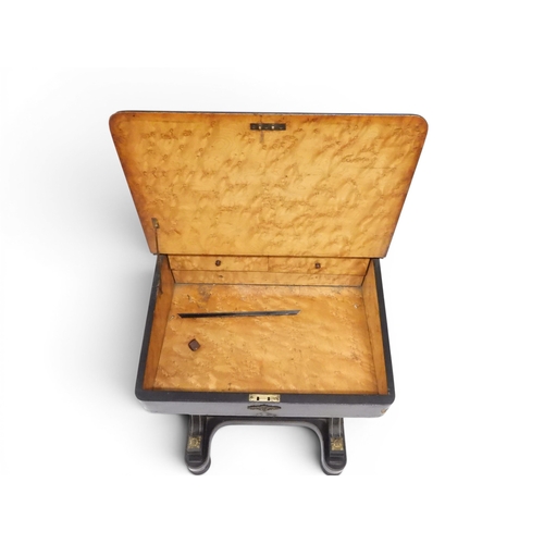 2002 - A VICTORIAN EBONISED AESTHETIC MOVEMENT DAVENPORT WRITING DESK with pierced brass gallery top over h... 