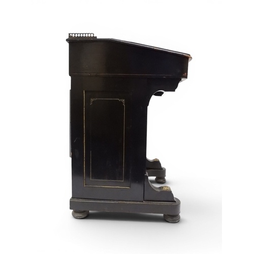 2002 - A VICTORIAN EBONISED AESTHETIC MOVEMENT DAVENPORT WRITING DESK with pierced brass gallery top over h... 