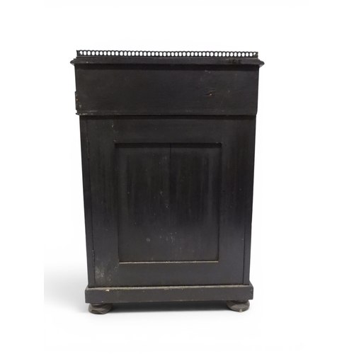 2002 - A VICTORIAN EBONISED AESTHETIC MOVEMENT DAVENPORT WRITING DESK with pierced brass gallery top over h... 