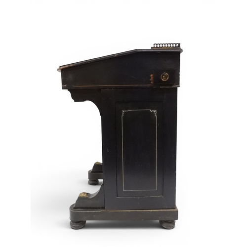 2002 - A VICTORIAN EBONISED AESTHETIC MOVEMENT DAVENPORT WRITING DESK with pierced brass gallery top over h... 