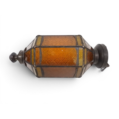 2004 - A LATE 19TH CENTURY MOROCCAN STYLE OCTAGONAL COPPER AND STAINED GLASS CANDLE LANTERNwith rise and fa... 