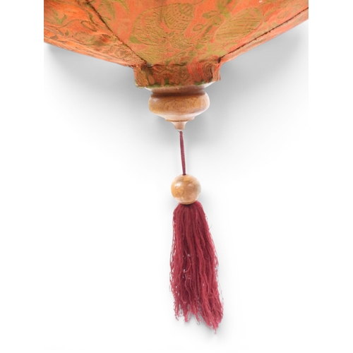 2004 - A LATE 19TH CENTURY MOROCCAN STYLE OCTAGONAL COPPER AND STAINED GLASS CANDLE LANTERNwith rise and fa... 