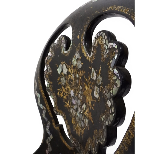2009 - A 19TH CENTURY BLACK LACQUERED PAPIER MACHE BERGERE PARLOUR CHAIRwith moulded gilt painted mother of... 