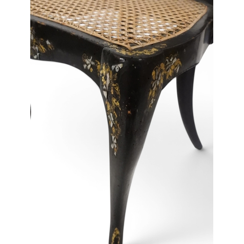 2009 - A 19TH CENTURY BLACK LACQUERED PAPIER MACHE BERGERE PARLOUR CHAIRwith moulded gilt painted mother of... 