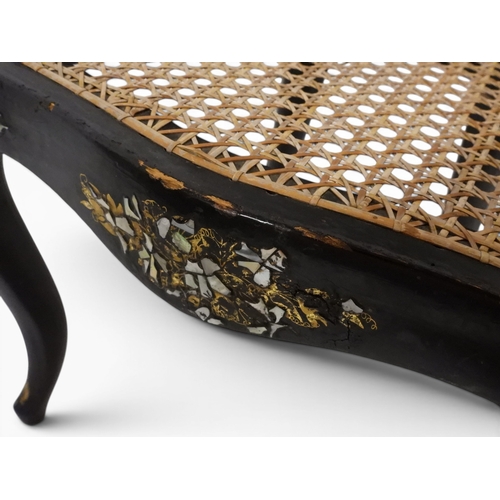 2009 - A 19TH CENTURY BLACK LACQUERED PAPIER MACHE BERGERE PARLOUR CHAIRwith moulded gilt painted mother of... 