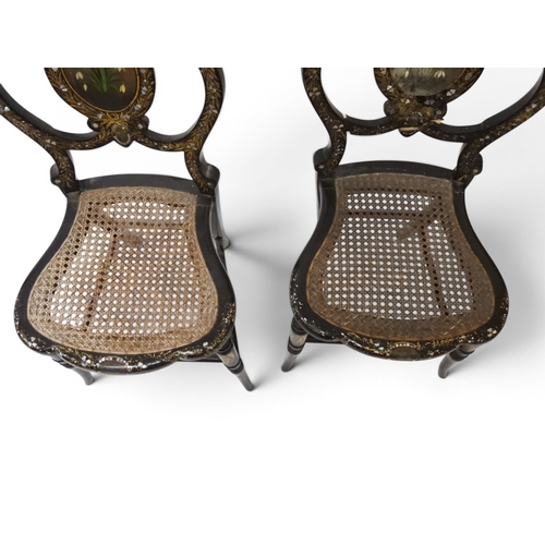 2009 - A 19TH CENTURY BLACK LACQUERED PAPIER MACHE BERGERE PARLOUR CHAIRwith moulded gilt painted mother of... 