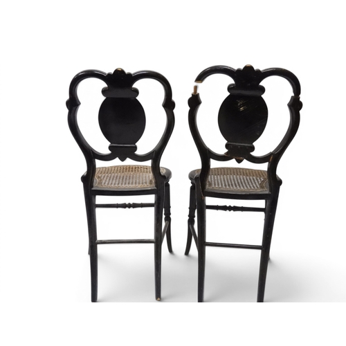 2009 - A 19TH CENTURY BLACK LACQUERED PAPIER MACHE BERGERE PARLOUR CHAIRwith moulded gilt painted mother of... 
