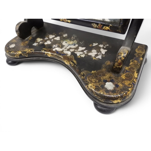 2009 - A 19TH CENTURY BLACK LACQUERED PAPIER MACHE BERGERE PARLOUR CHAIRwith moulded gilt painted mother of... 