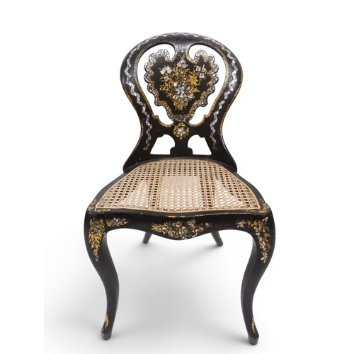 2009 - A 19TH CENTURY BLACK LACQUERED PAPIER MACHE BERGERE PARLOUR CHAIRwith moulded gilt painted mother of... 