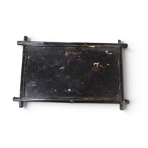 2009 - A 19TH CENTURY BLACK LACQUERED PAPIER MACHE BERGERE PARLOUR CHAIRwith moulded gilt painted mother of... 