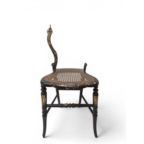 2009 - A 19TH CENTURY BLACK LACQUERED PAPIER MACHE BERGERE PARLOUR CHAIRwith moulded gilt painted mother of... 