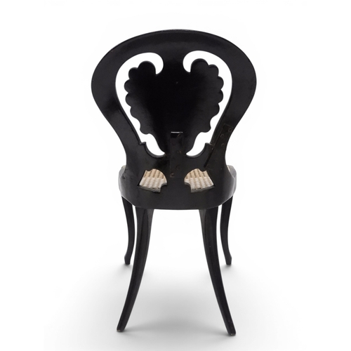 2009 - A 19TH CENTURY BLACK LACQUERED PAPIER MACHE BERGERE PARLOUR CHAIRwith moulded gilt painted mother of... 