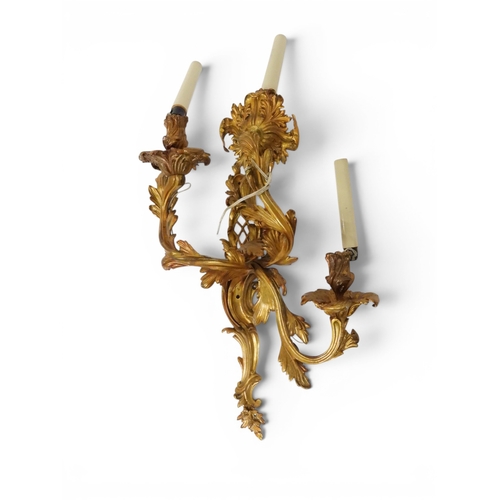 2014 - A PAIR OF 20TH CENTURY GILT METAL REGENCY STYLE FIVE BRANCH CANDLE WALL SCONCESwith scrolled floral ... 