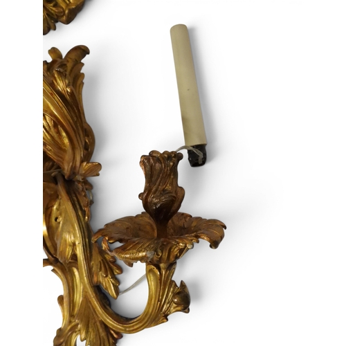 2014 - A PAIR OF 20TH CENTURY GILT METAL REGENCY STYLE FIVE BRANCH CANDLE WALL SCONCESwith scrolled floral ... 