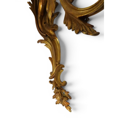 2014 - A PAIR OF 20TH CENTURY GILT METAL REGENCY STYLE FIVE BRANCH CANDLE WALL SCONCESwith scrolled floral ... 