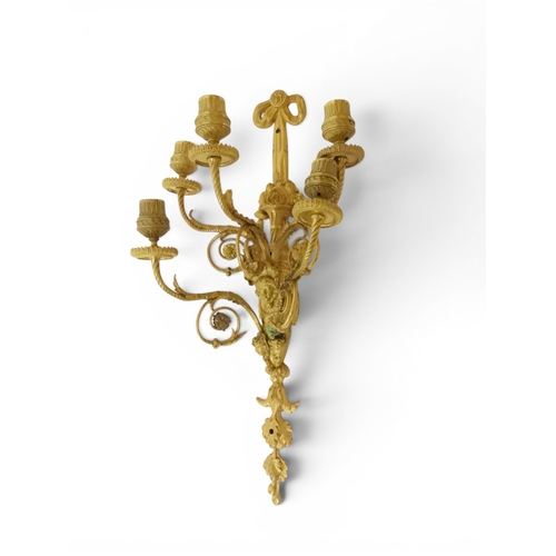 2014 - A PAIR OF 20TH CENTURY GILT METAL REGENCY STYLE FIVE BRANCH CANDLE WALL SCONCESwith scrolled floral ... 