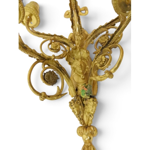 2014 - A PAIR OF 20TH CENTURY GILT METAL REGENCY STYLE FIVE BRANCH CANDLE WALL SCONCESwith scrolled floral ... 