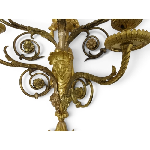2014 - A PAIR OF 20TH CENTURY GILT METAL REGENCY STYLE FIVE BRANCH CANDLE WALL SCONCESwith scrolled floral ... 