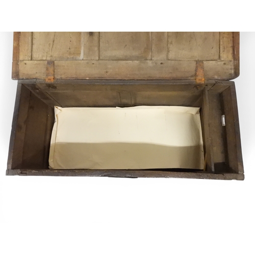 2022 - A 17TH/18TH CENTURY OAK BLANKET CHESTwith three panel lid with wrought iron fitting over carved thre... 