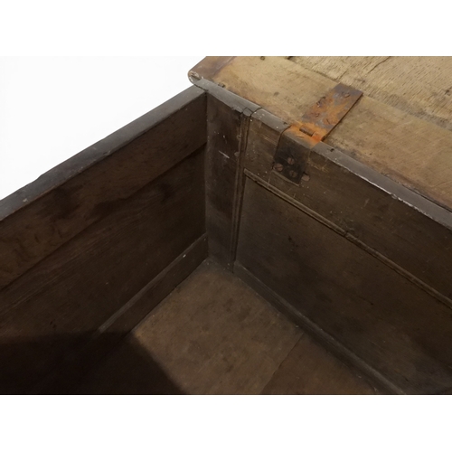 2022 - A 17TH/18TH CENTURY OAK BLANKET CHESTwith three panel lid with wrought iron fitting over carved thre... 