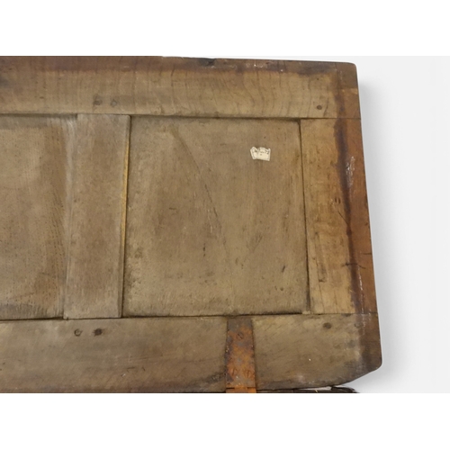 2022 - A 17TH/18TH CENTURY OAK BLANKET CHESTwith three panel lid with wrought iron fitting over carved thre... 