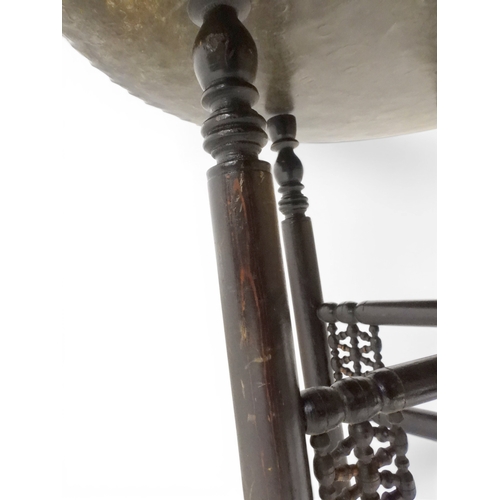 2023 - A 19TH/20TH CENTURY MOORISH COPPER TRAY TOP FOLDING TABLEcircular copper top with raised gallery edg... 
