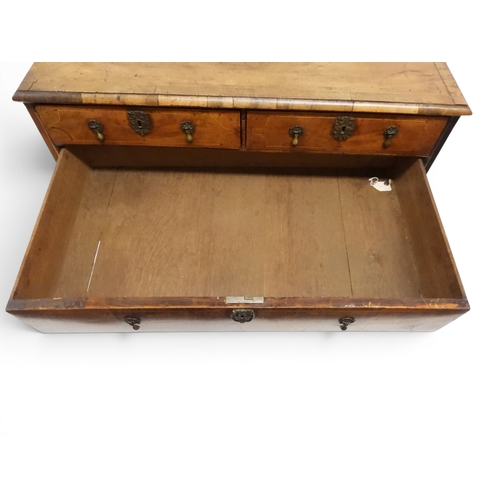 2024 - A 17TH CENTURY WILLIAM AND MARY WALNUT VENEERED CHEST OF DRAWERSwith satinwood inlaid top over two s... 