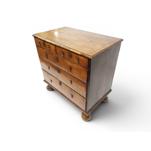 2024 - A 17TH CENTURY WILLIAM AND MARY WALNUT VENEERED CHEST OF DRAWERSwith satinwood inlaid top over two s... 